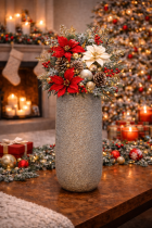 Festive holiday arrangement in silver vase