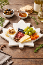 Charcuterie on a maple cheese board