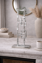 Geometric sculpture on stone mantel