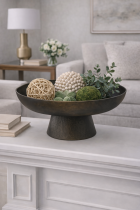 Decorative accents on a white mantel