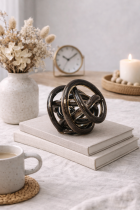 Decorative glass knot on wooden surface