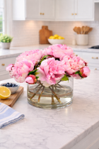 Bouquet of pink peonies on marble countertop