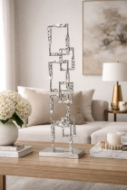 Modern living room with silver sculpture