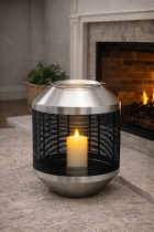 Lantern by the warm fireplace