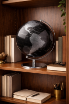 Globe and books on a walnut shelf