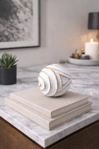 Antique sphere on stacked books