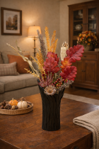 Dried floral arrangement on rustic table
