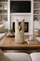 Cracked stone vase in cozy living room