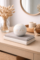 Decorative sphere on rustic console table