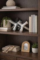 Sculptures and plants on a wooden shelf