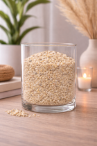 Glass vase with pale pebbles