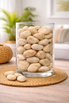 Glass vase with smooth river stones