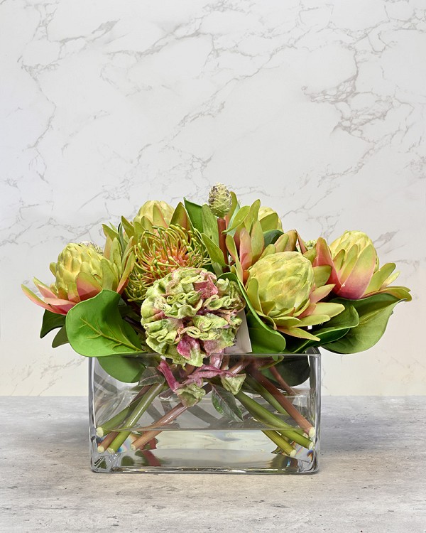 Square glass vase with Protea in faux water