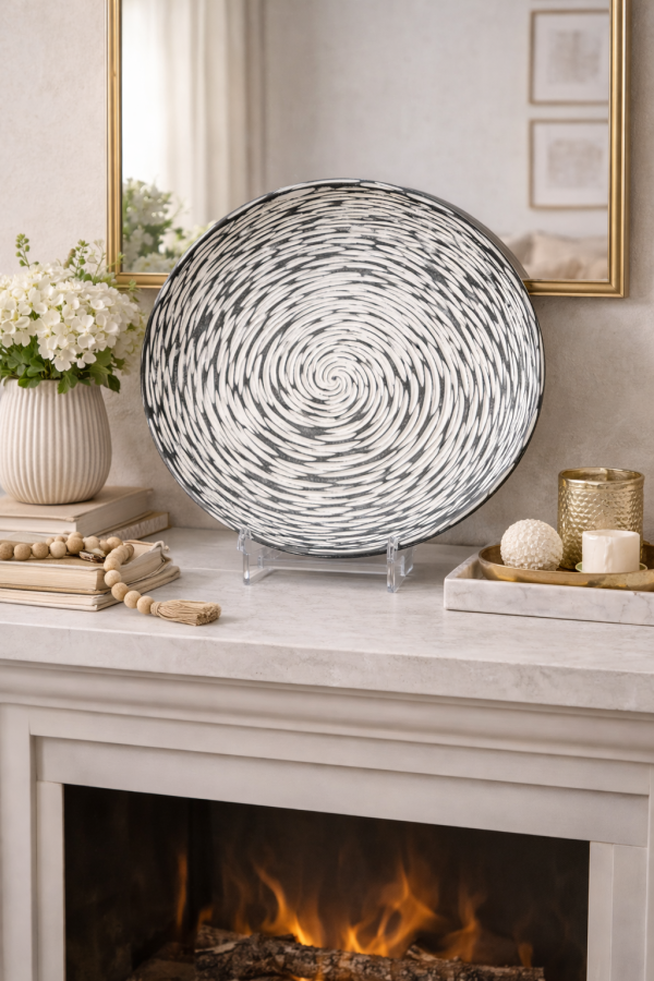 Elegant mantel decor with spiral plate