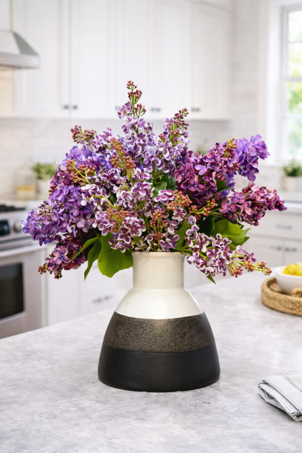 Bouquet of lilacs on kitchen countertop