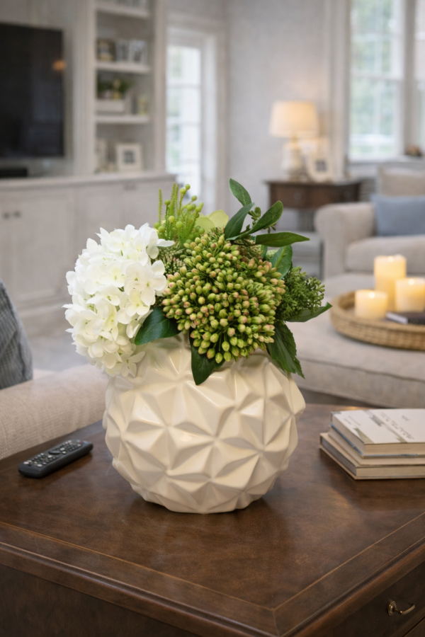 Floral arrangement in geometric vase